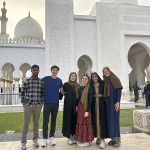 Students in the ThinkImpact program stand outside a mosque in Dubai