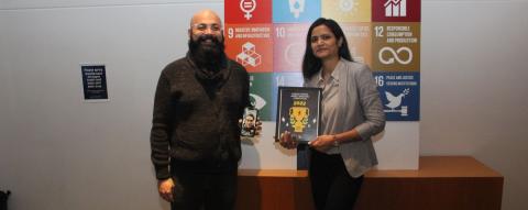 Photo of First place winners Syuash Pranjal and Anshul Gupta holding their award.