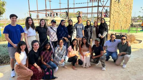 Students in ThinkImpact program take a group photo outside in Dubai