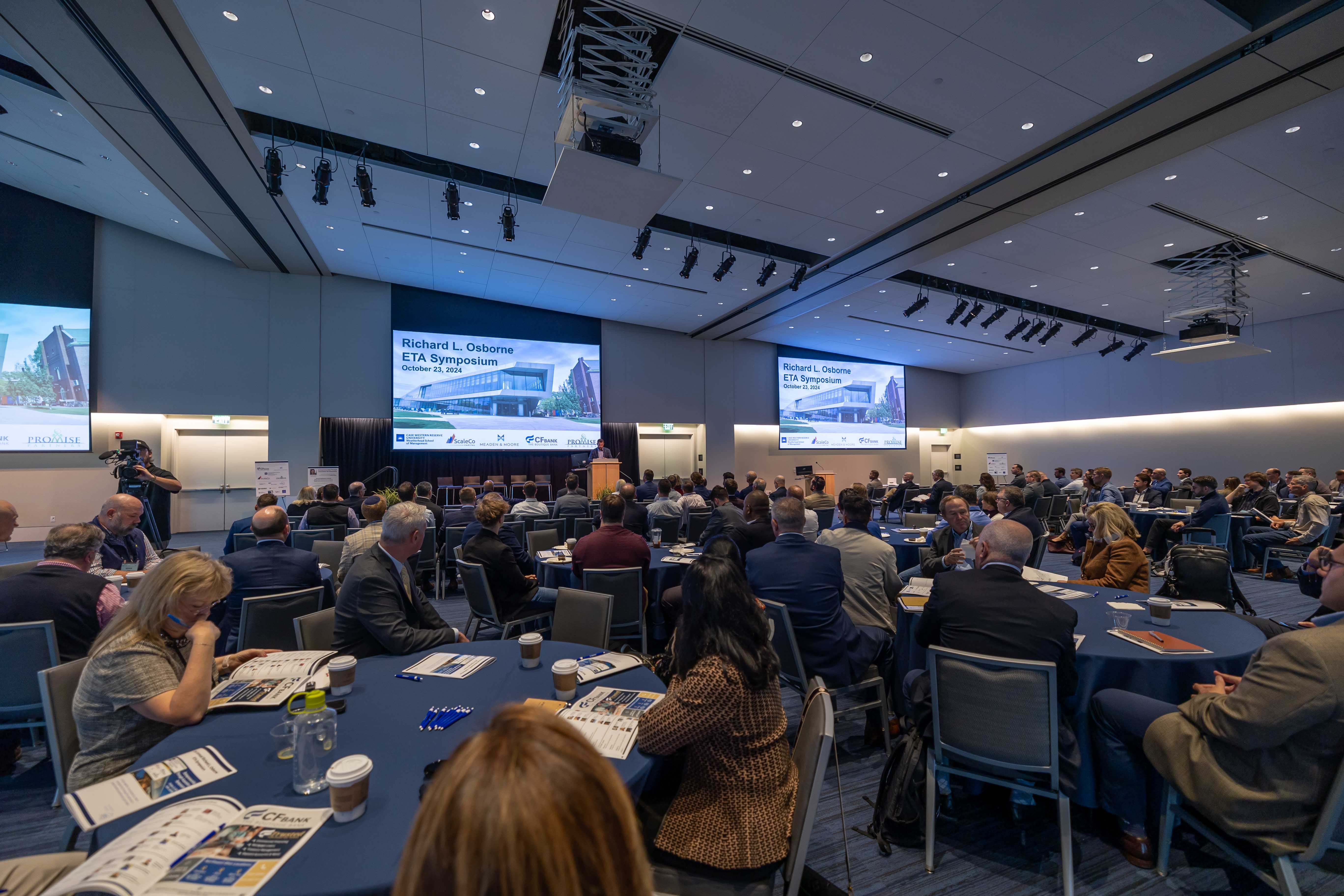 A room of people attending ETA Symposium