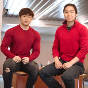 Danny Lee and Michael Zhou, co-founders of Redheart pose in red shirts