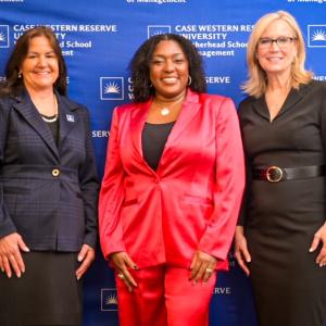 Laura Leopardi, Yvette Simpson, and Laura Guilliam pose for a photo at the Women's Leadership Luncheon