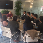 Conference room with students meeting with Wall Street executive