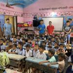 Kareem Agag and Aayush Parikh in a young children's classroom in India