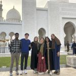 ThinkImpact students stand outside a beautiful building in Dubai.
