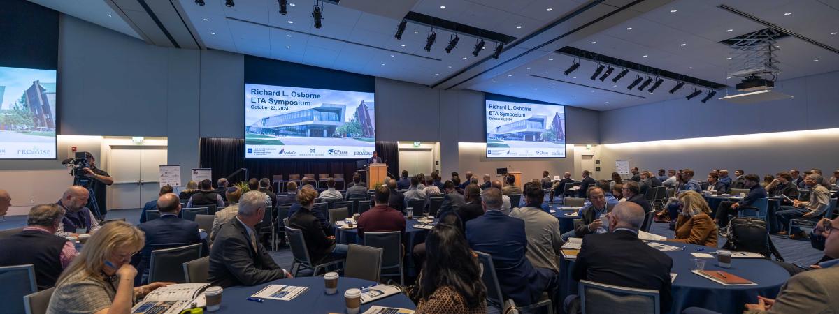 A room of people attending ETA Symposium