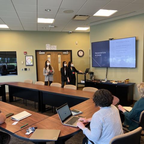 Photo of Weatherhead students presenting for teachers at Magnificat High School