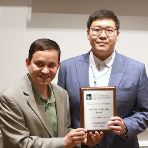 Shawn Sun holding "Student Leadership Award" Plaque