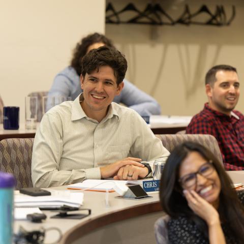 Smiling students in a lecture hall