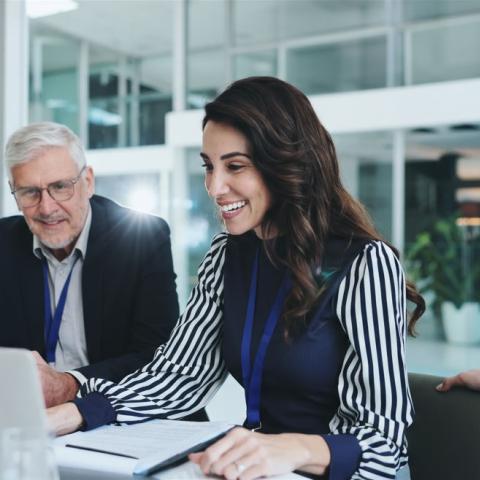 Professionals sitting at a table collaborating together
