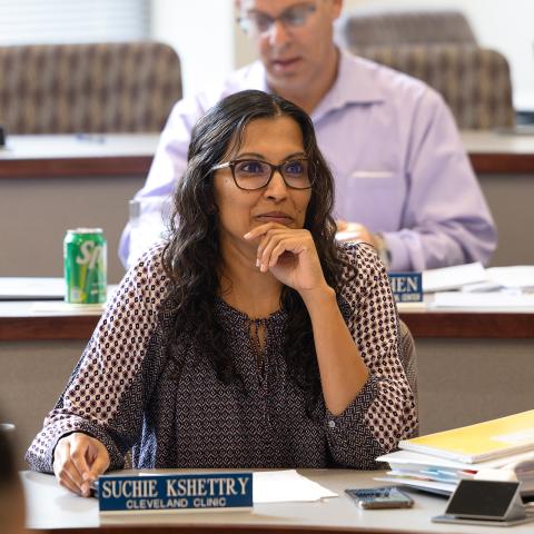 Two students sitting at desks in a classroom