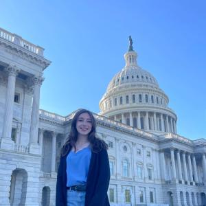 Grace Harrison smiles in front of the U.S. Capitol building in D.C.