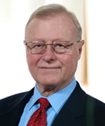 Headshot photo of Larry Parker, wearing a black suit jacket and red necktie