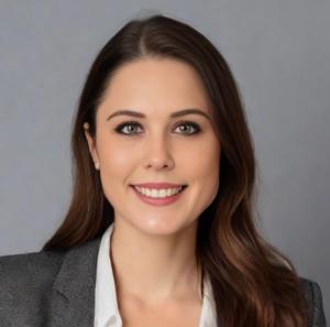 Headshot image of Emma Krejci, who is wearing a dark blazer and white shirt