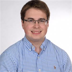 Headshot image of Jared Berg, who is wearing a blue button-down shirt