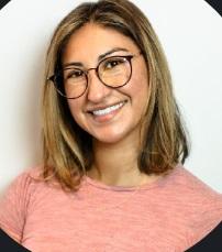 Headshot image of Suzette Alcanta, who is wearing a pink blouse