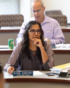 Two students sitting at desks in a classroom