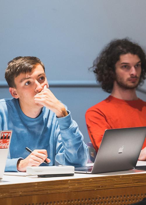 Two students listening to a lecture