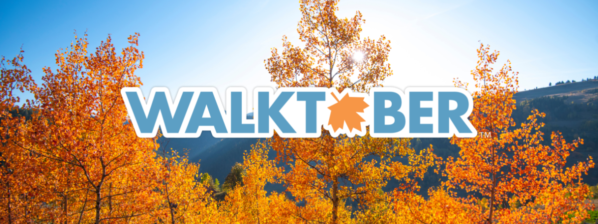 Walktober logo in front of scenic autumn woods