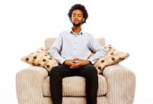 A guy sitting on a sofa
