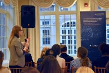 Woman asks question at event