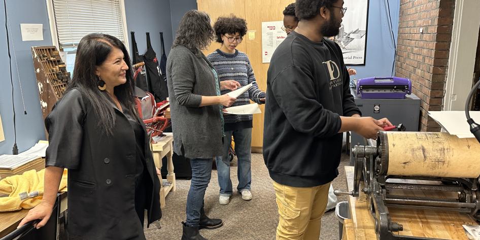 Students work in the letterpress with Ada Limon.