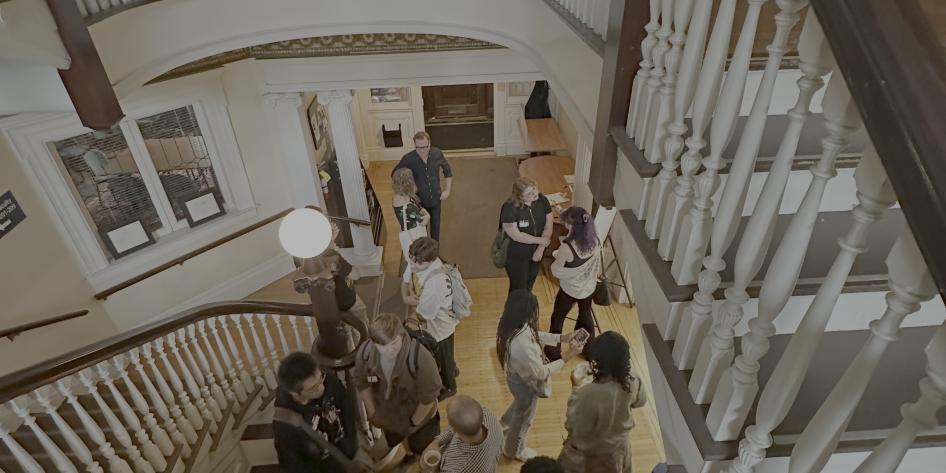 People gathered in the Writers House foyer.