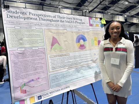 Ify Chidi with her award-winning poster at Spring Intersections (2026).